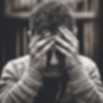adult person sad, head in hands, brown and black and white image.jpg
