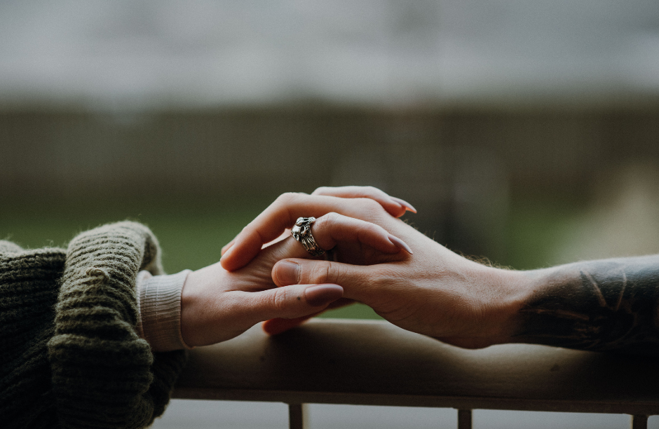 two hands being held to symbolize relationship counseling