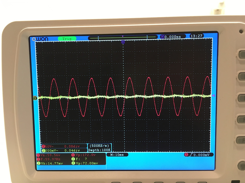 oscilloscope scan of 60hz sine wave (red) and dirty electricity (yellow)