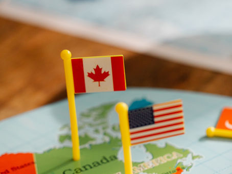 Nên Định Cư Mỹ Hay Canada? So Sánh Toàn Diện Năm 2026