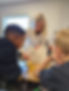 Teacher helping students learn math