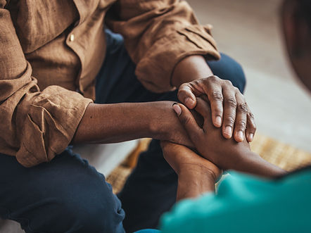 Closeup of a support hands. Closeup shot of a young woman holding a senior man's hands in