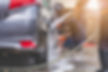 Car washing. cleaning car worker using