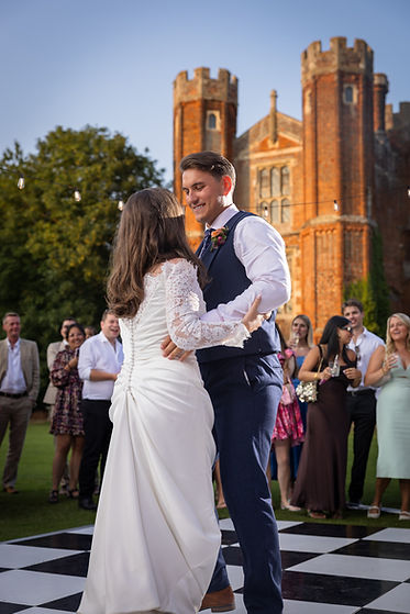bride and groom first dance outside at leez priory