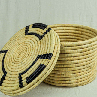 Handwoven Tunisian storage basket with matching lid made from natural palm fibres