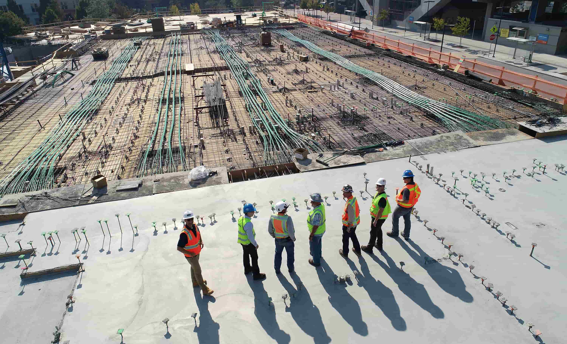 Construction workers standing at a large building site in Tunisia