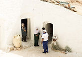 People gathered outside a traditional workshop in Tunisia.
