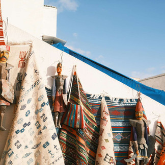 Traditional Tunisian textiles displayed outside a medina shop