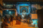People gathering outside a café and guesthouse in Sidi Bou Saïd during the evening