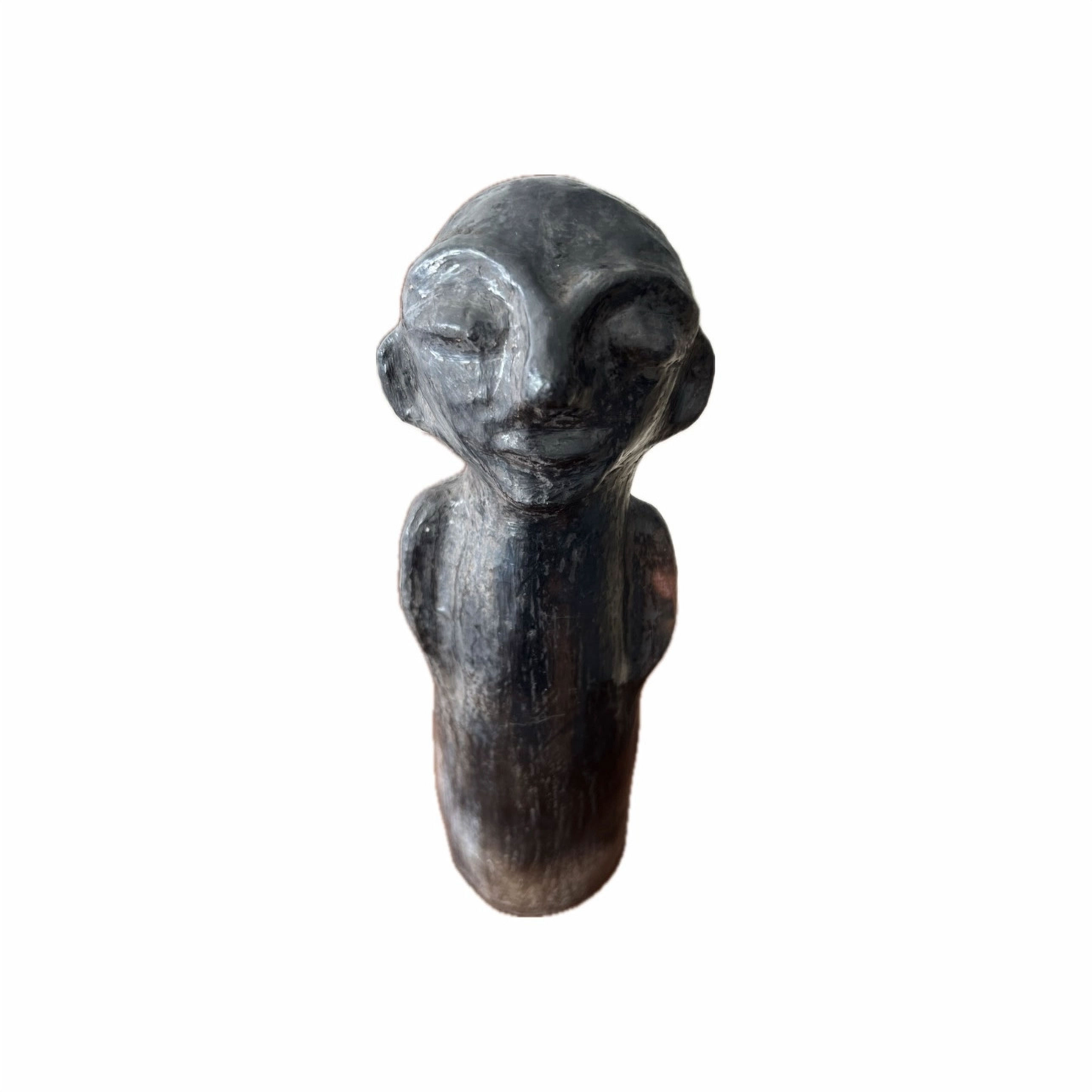 Dark Sejnane standing figure by Hadda Saidani with a rounded head, modelled face, and narrow body.