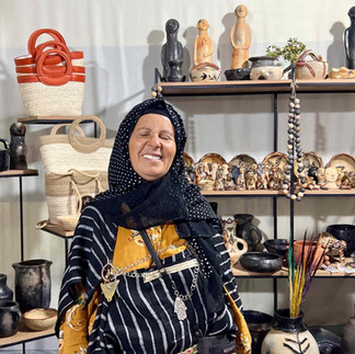 Tunisian artisan surrounded by handmade objects shaped through skill, repetition, and long-term practice
