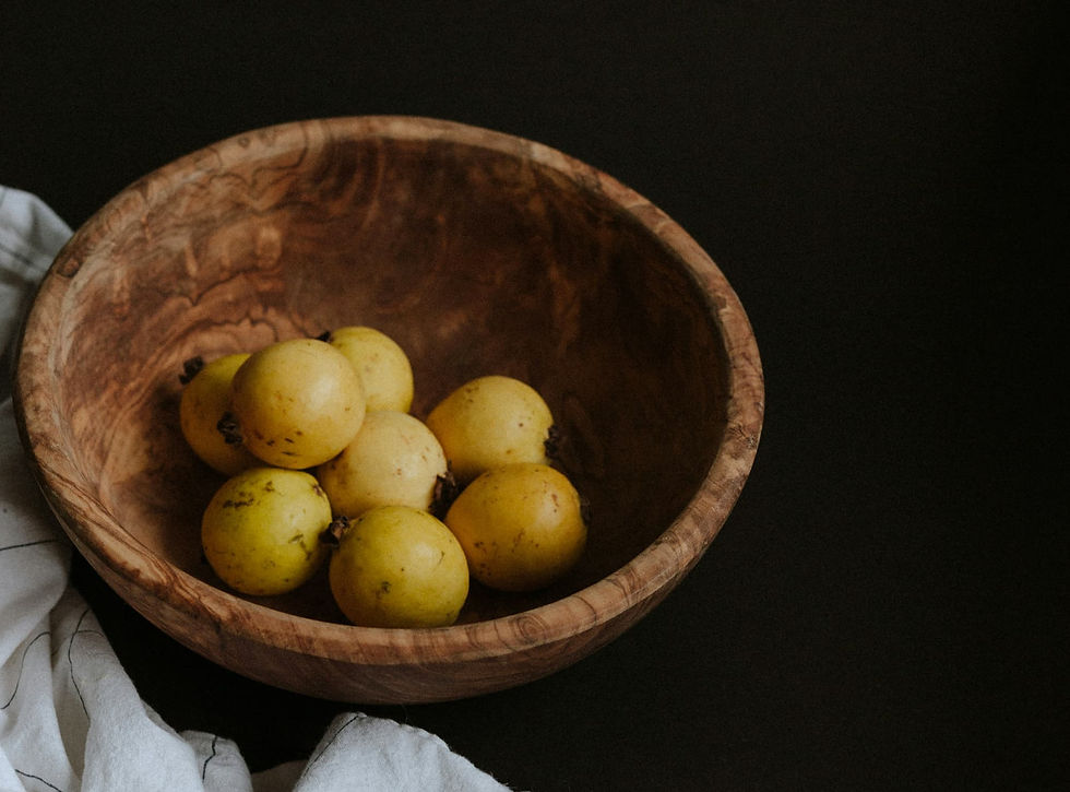 Thick olive wood bowl with visible rim thickness and dense irregular grain, demonstrating structural proportion for material movement stability.