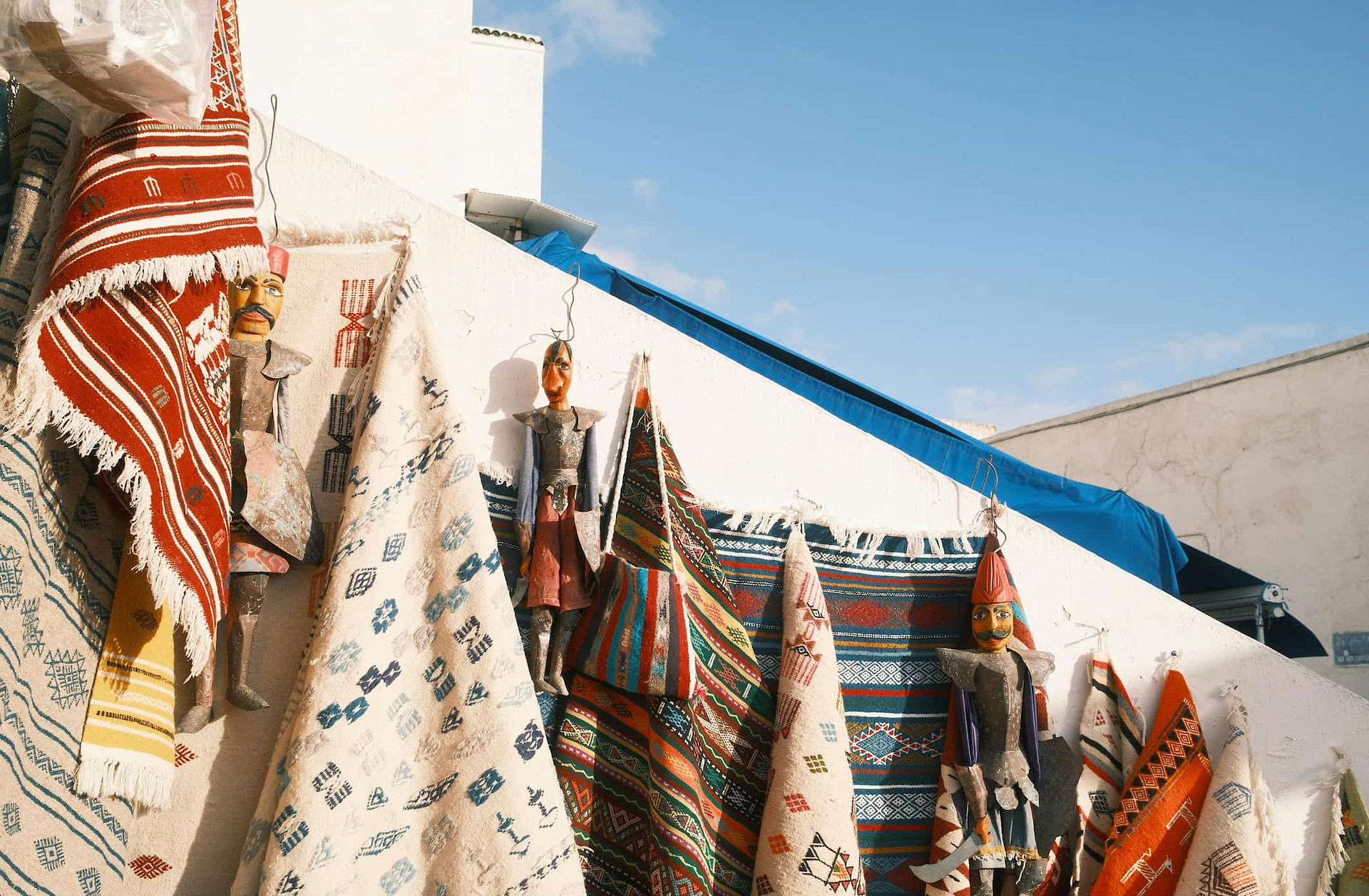 Handmade Tunisian textiles showing natural variation in weave, color, and density, reflecting material differences and manual production.