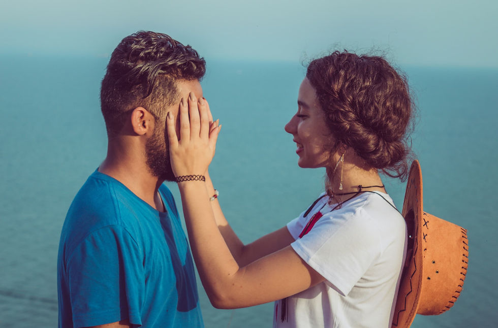 Young couple sharing a quiet moment by the sea in Tunisia