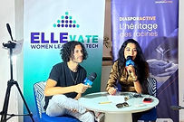 Two participants in conversation during an ELLEvate program event in Tunisia.