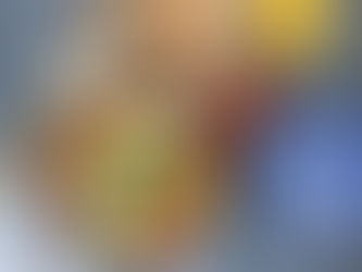 Shakshouka cooked in a pan with tomatoes, olive oil, and eggs, shown with raw ingredients used in Tunisian home cooking.