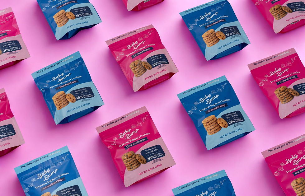 chocolate chip and oatmeal raisin prenatal cookie bags lined up in a row on a pink backdrop