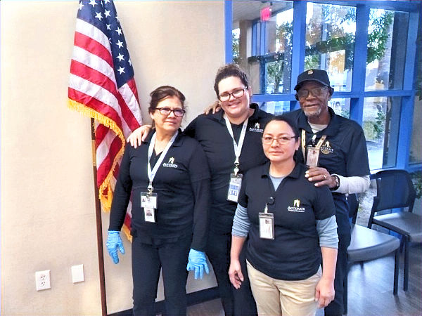 (L to R) Maida Diaz, Ana Barroso, Rosa, and Daniel Williams take care of neighboring suites in the same corporate office complex.
