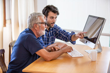 youngmanhelpingoldermanlaptop.jpeg