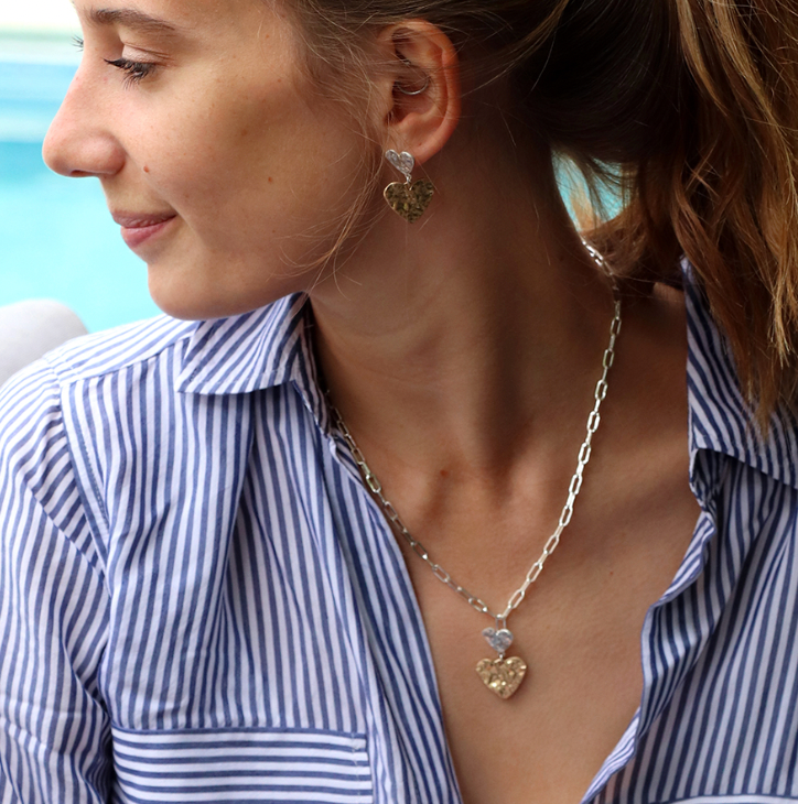 Model wearing Silver link necklace with silver and gold beaten hearts