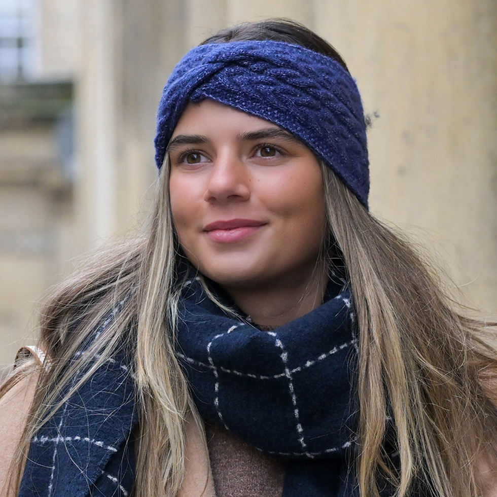 Model wearing Navy blue recycled herringbone knot twist headband