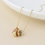 Thumbnail: Golden multi crystal hoop necklace with pink hearts