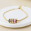 Thumbnail: Golden multi crystal hoop bracelet with pink hearts