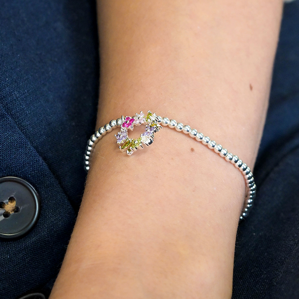 Lady wearing Silver plated floral crystal circle stretch bracelet