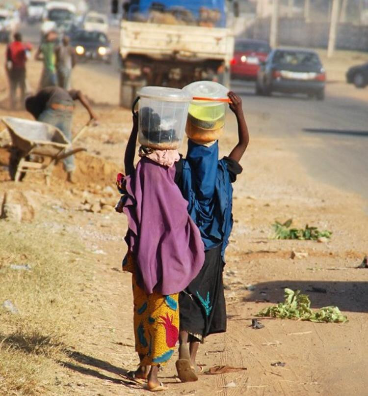 Photo of two girls hawking at Samaru, Zaria.