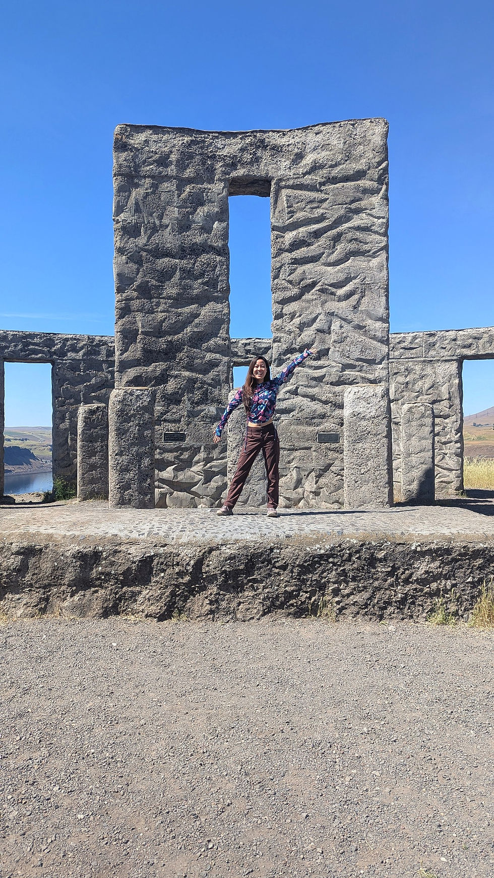 Hiker standing at Maryhill Stonehenge in Washington
