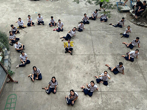 Children of Que Huong Humanity Center forming a heart, seen from above