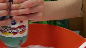 Child and therapist making homemade slime together