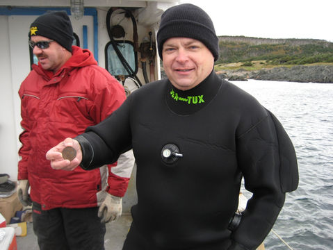 Terry Dwyer with a Mexican Silver Pillar Dollar recovered off St. Paul Island.