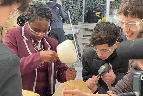 Pupils learn stonemasonry at a workshop.jpeg