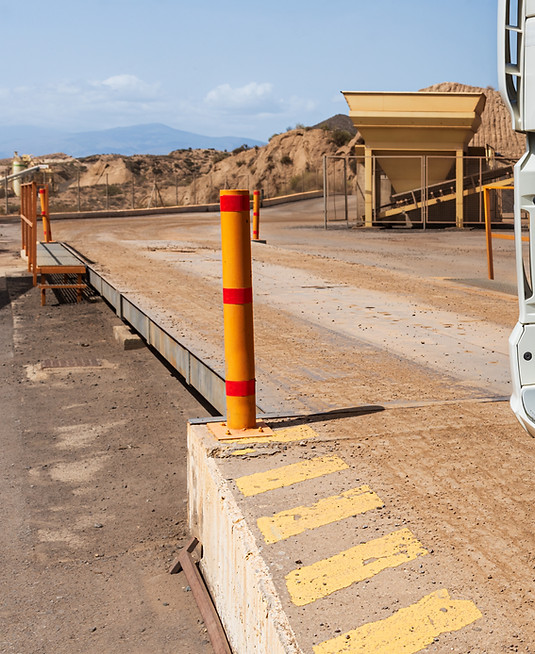 Truck entering a weighing scale in a quarry.jpg