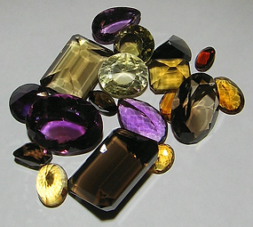 faceted quartz crystals , some being healing crystals, they include citrine, amethyst and smokey quartz
