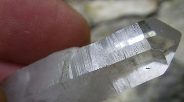 Here a crystal collector can see horizontal striations across a quartz prism