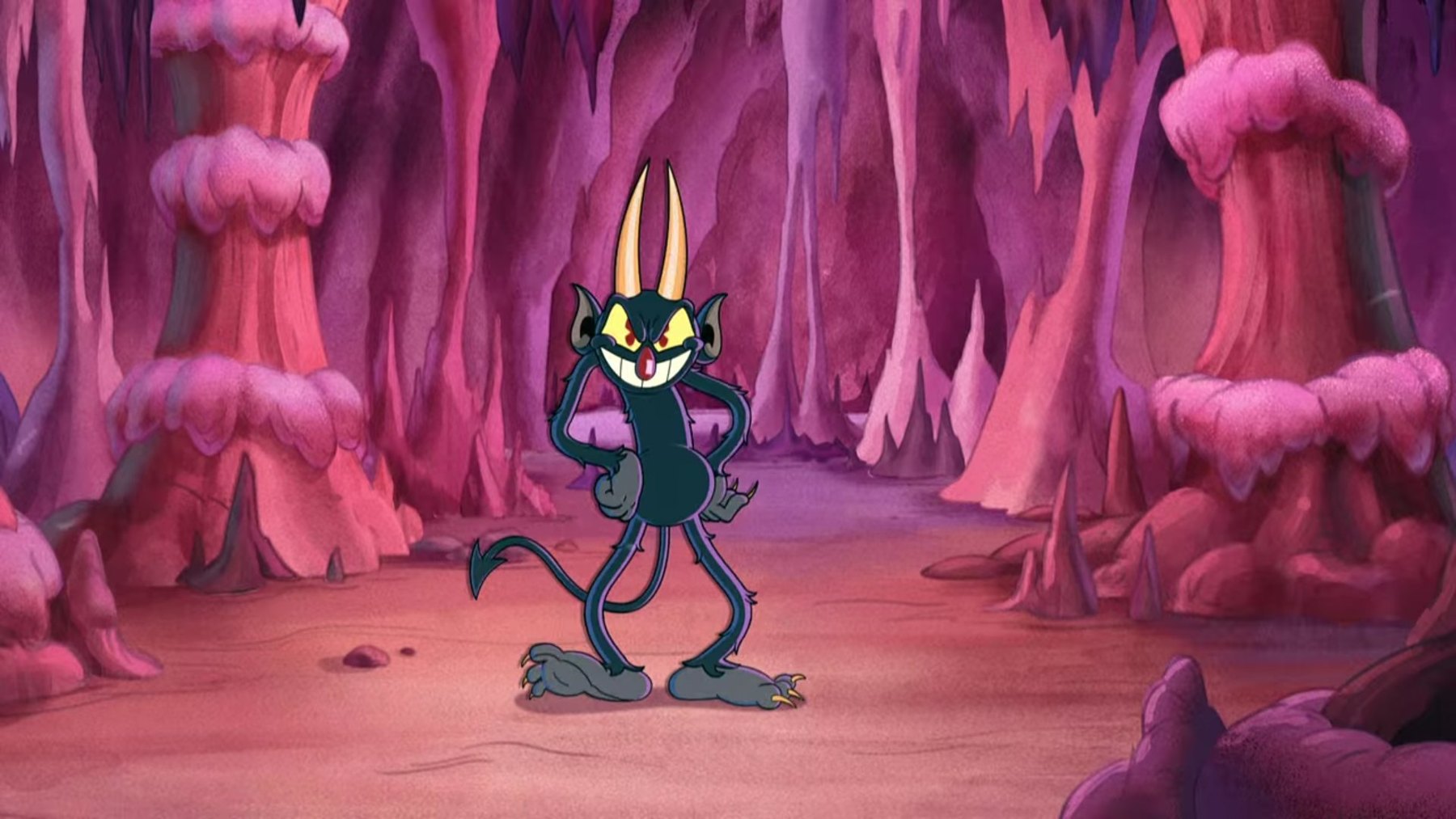 The Devil poses, hands on hips, in a pink cavern