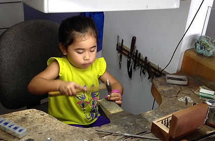 Jim's 3 year old granddaughter in action at the workbench. Adorable and Intense!