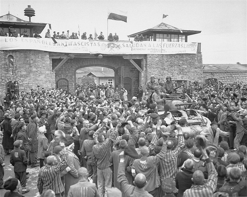 1945_Mauthausen survivors cheer the soldiers of the Eleventh Armored Division of the U.S