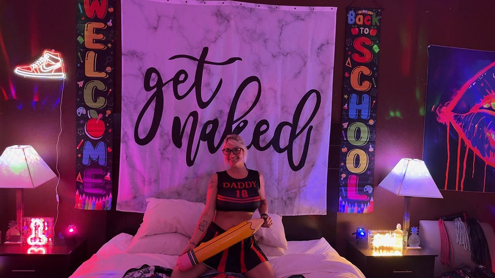 Ashlay Sweety (@ashlaysweet) in her decorated room crawl room with welcome banners, neon lights and wall tapestries at a Lifeinstyle party in St. Louis