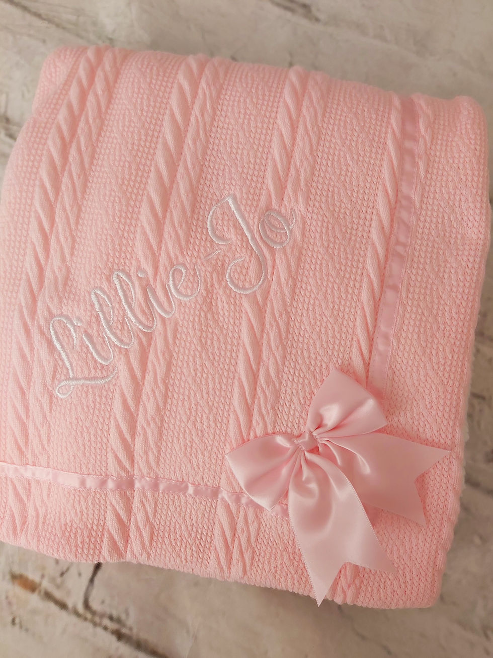 Thumbnail: KNITTED BLANKET WITH BOW