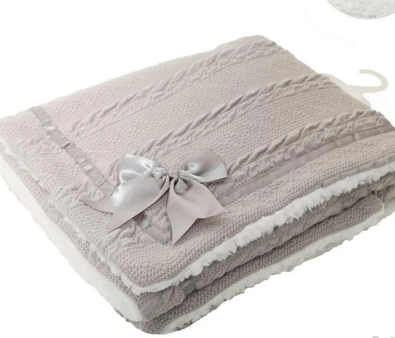 Thumbnail: KNITTED BLANKET WITH BOW