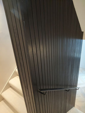 Contemporary ash timber wall cladding installed inside a luxury home.