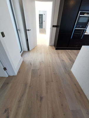 Modern kitchen fit-out with stone worktops and custom joinery