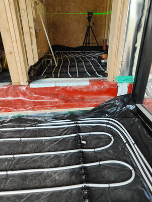 imber stud partition with underfloor heating installation in residential construction
