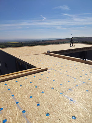 Flat roof structure showing construction detail and plywood deck prior to waterproofing