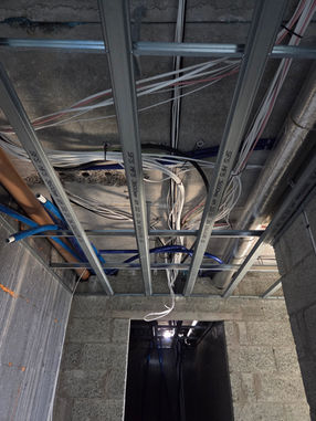 First fix electrical wiring completed before plastering in a home renovation.