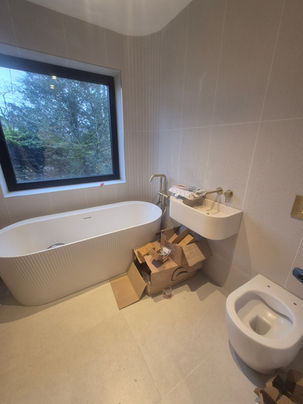 Main bathroom renovation with high-end finishes, custom tiling and modern fittings