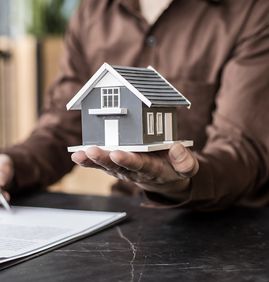 Surveyor inspecting roof during pre-purchase house survey